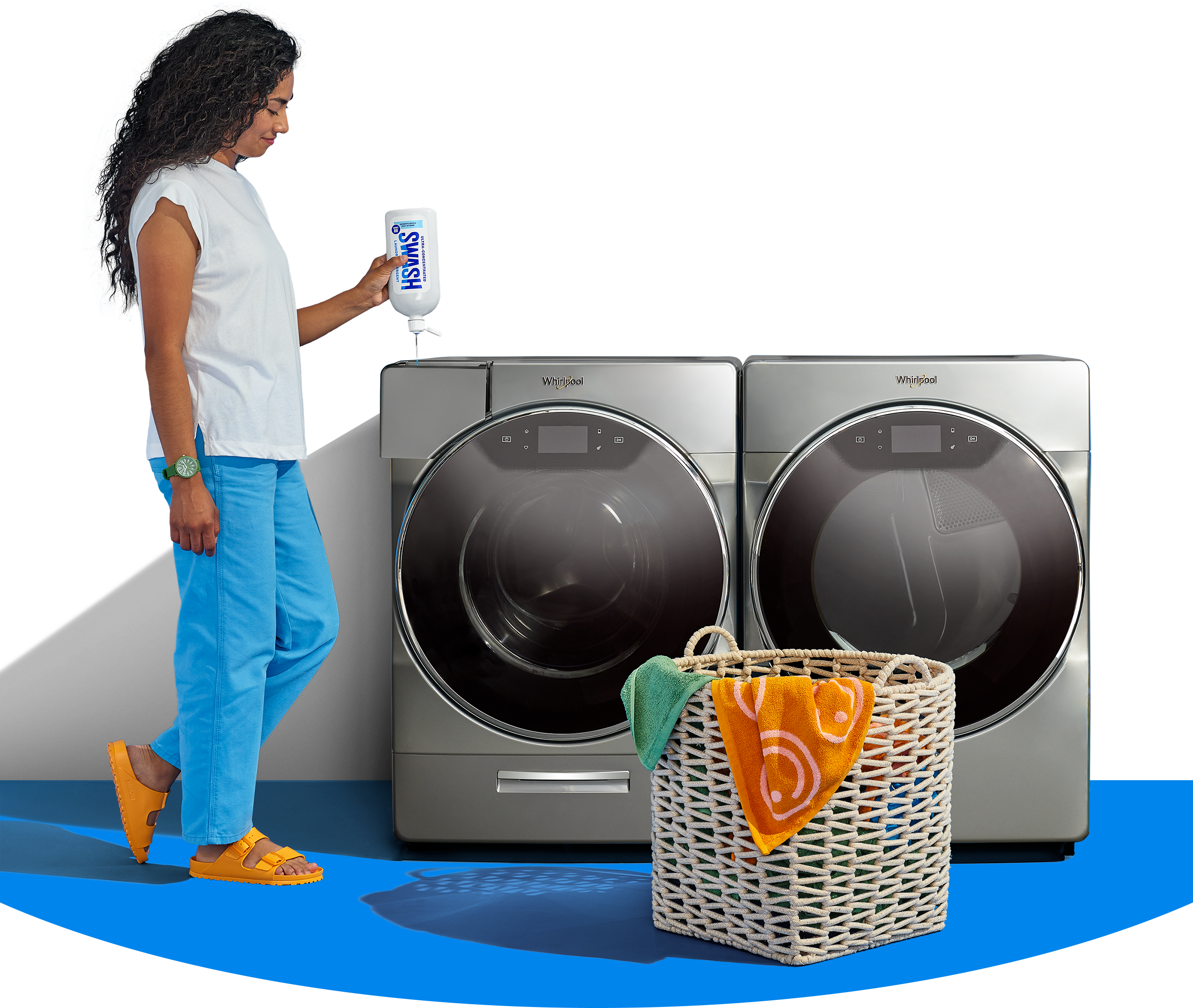 A woman filling a Whirlpool® front load washer with Swash® Laundry Detergent.