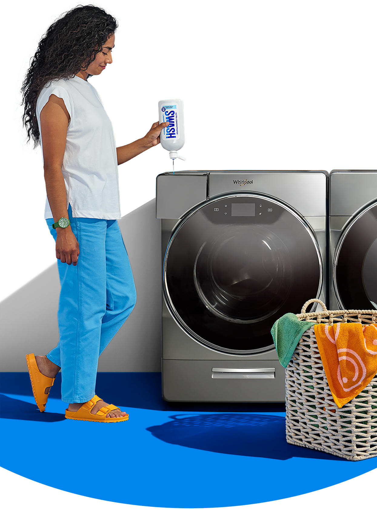A woman filling a Whirlpool® front load washer with Swash® Laundry Detergent