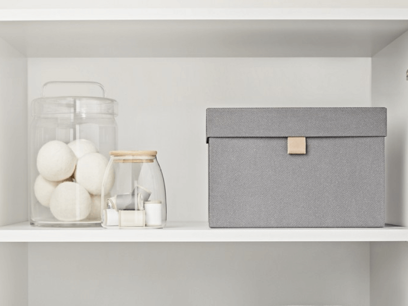 A neatly organized laundry room cabinets. A neatly organized laundry room cabinets.