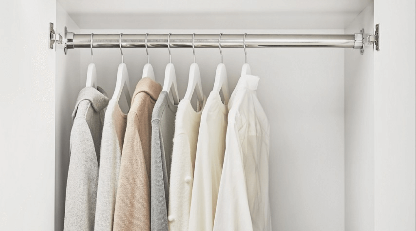 A cabinet in a laundry room with hanging space to dry and organize your clothes.