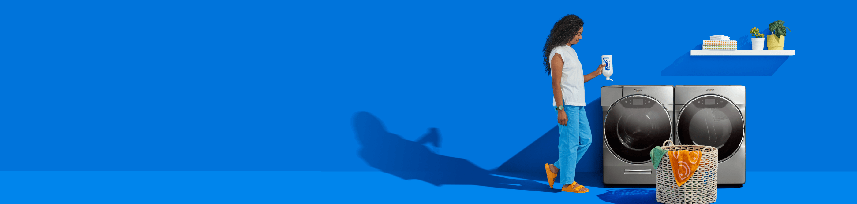 A person adding swash laundry detergent to a washer