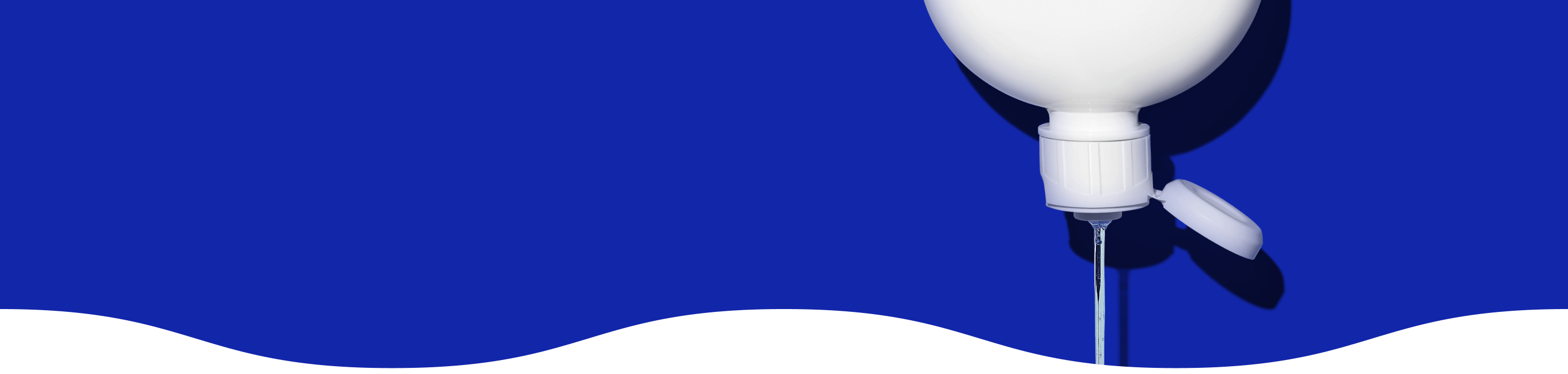 Swash® Laundry Detergent pouring out of upside down bottle