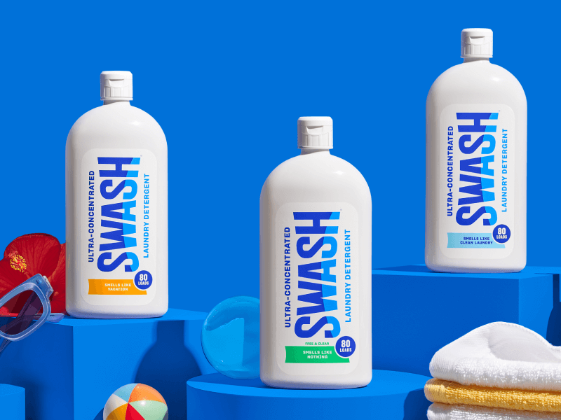 Three different bottles of Swash arranged on a counter