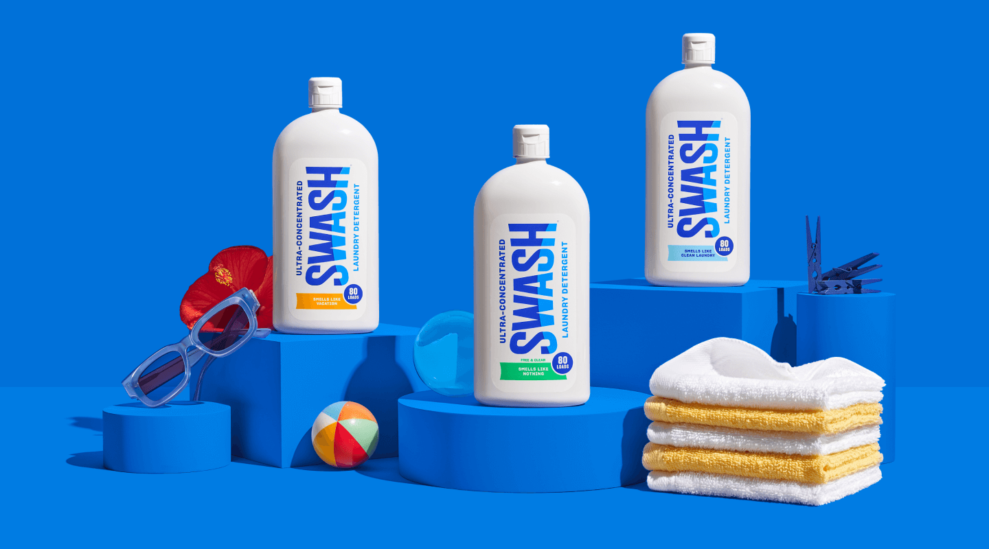 Three different bottles of Swash arranged on a counter