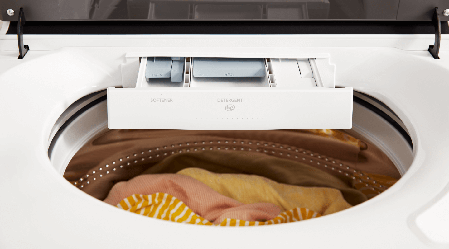 Open detergent dispenser on a Whirlpool® Washing Machine