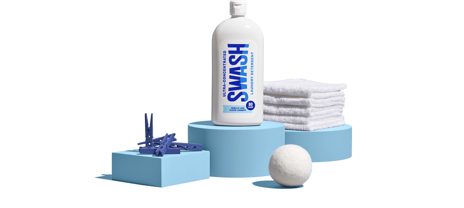 Swash® Laundry Detergent Smells Like Clean Laundry on pedestal with scent cues Swash® Laundry Detergent Smells Like Clean Laundry on pedestal with laundry supplies surrouding the bottle.