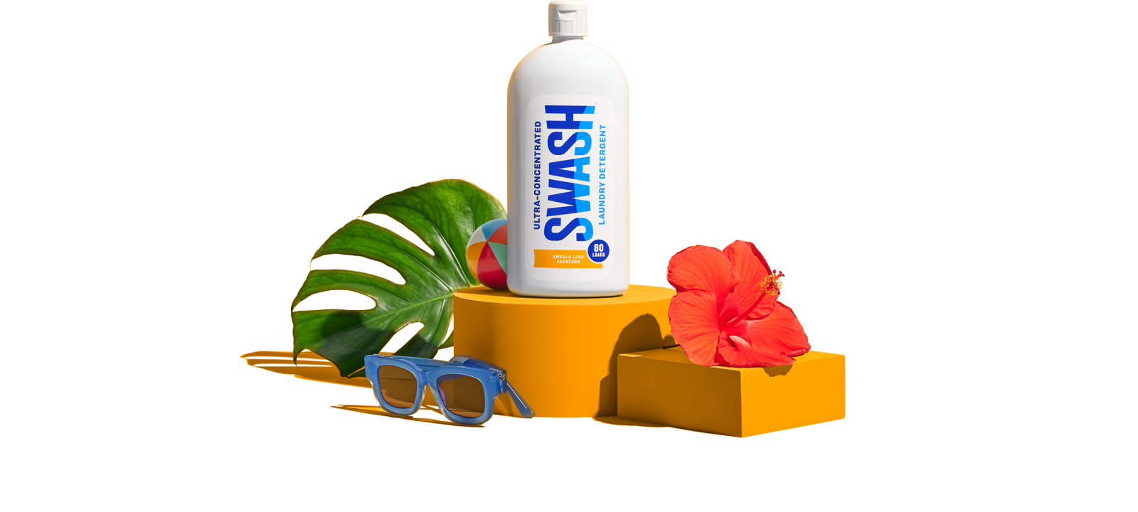 Swash® Laundry Detergent Smells Like Vacation on pedestal with vacation-themed items surrounding the bottle.
